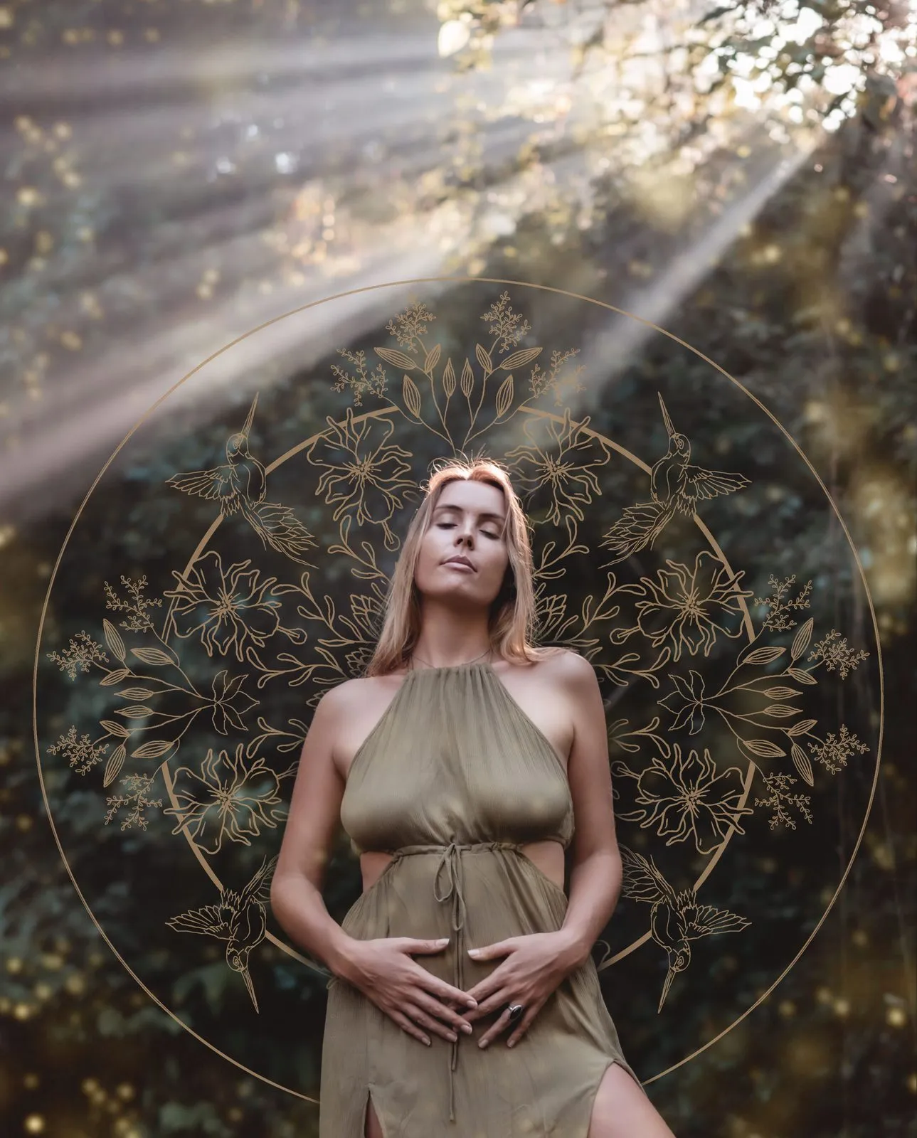 Sacred art: a woman in an olive dress in the forest with her hands on her belly, sunbeams and a golden mandala around her
