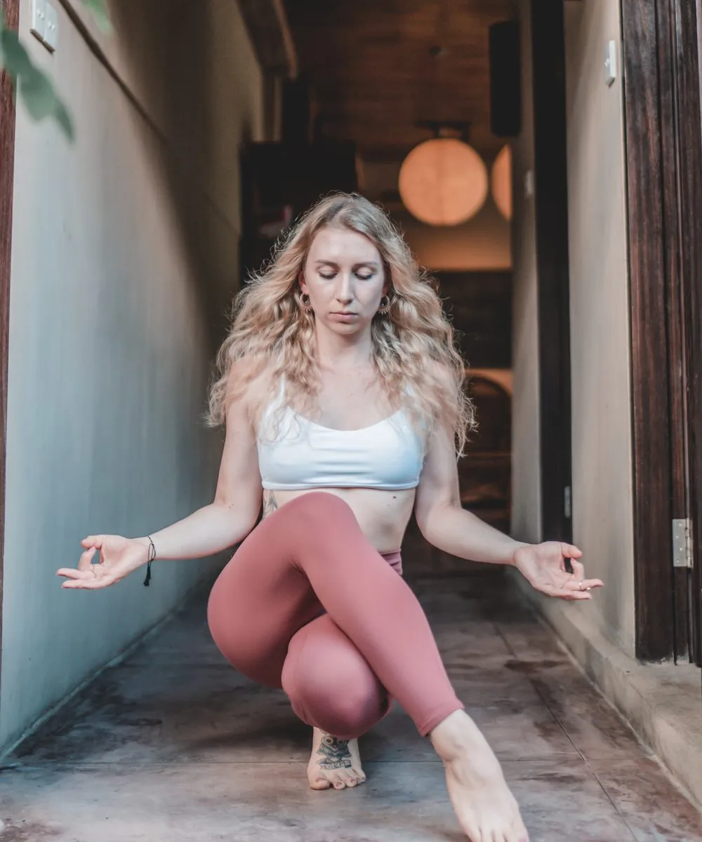 Yoga photography, a low lunge in the mist above Bali